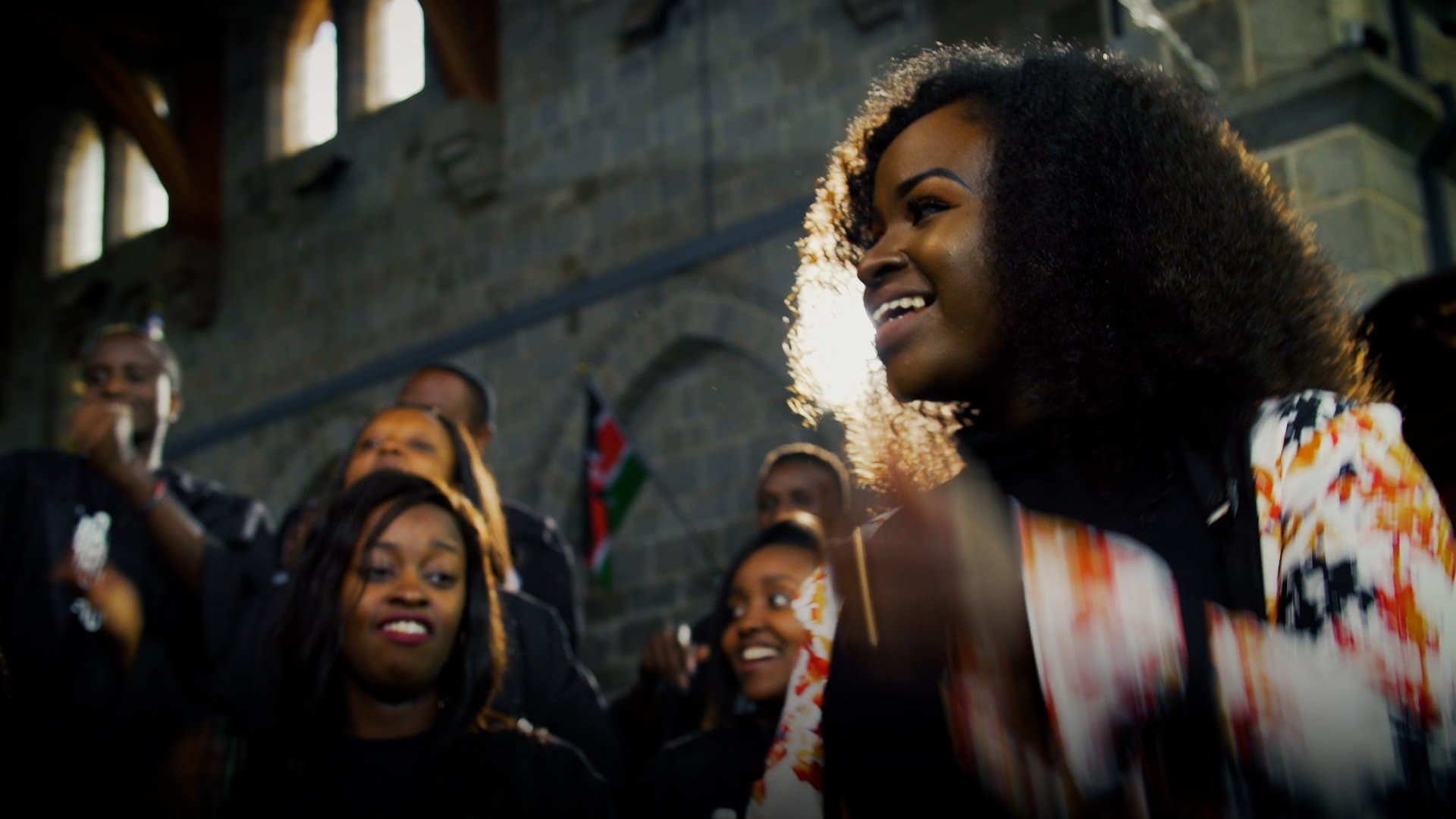 Mercy Masika smiling during worship
